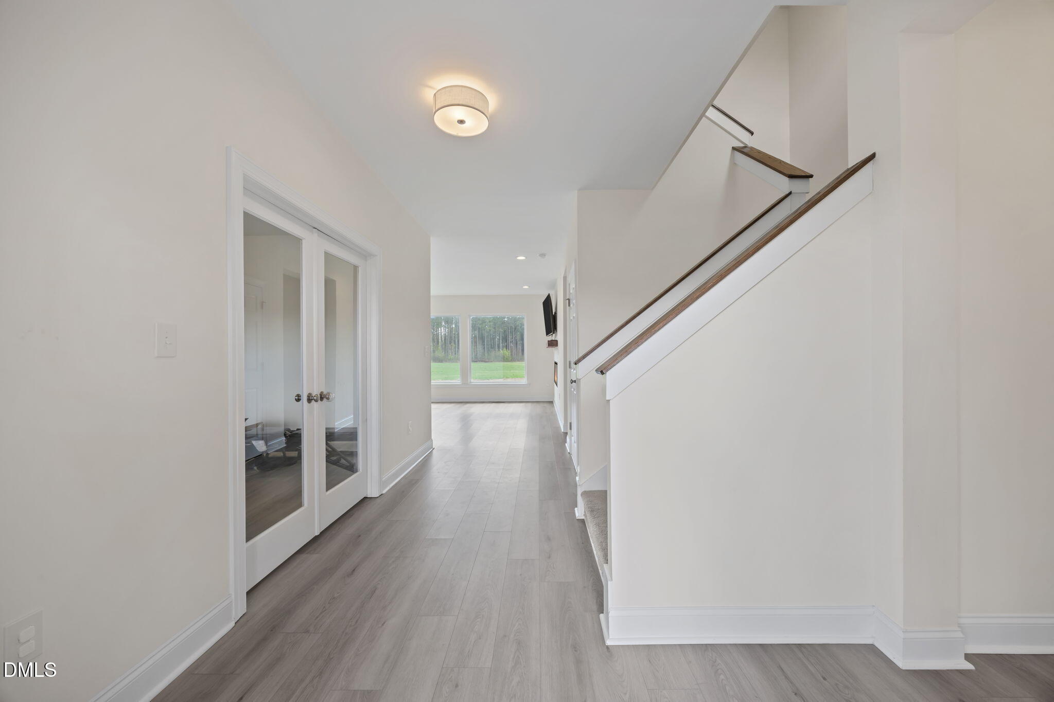 1049 Firetower Road Louisburg, NC 27549 - Photo 20 of 52 a view of a hallway with wooden floor and staircase