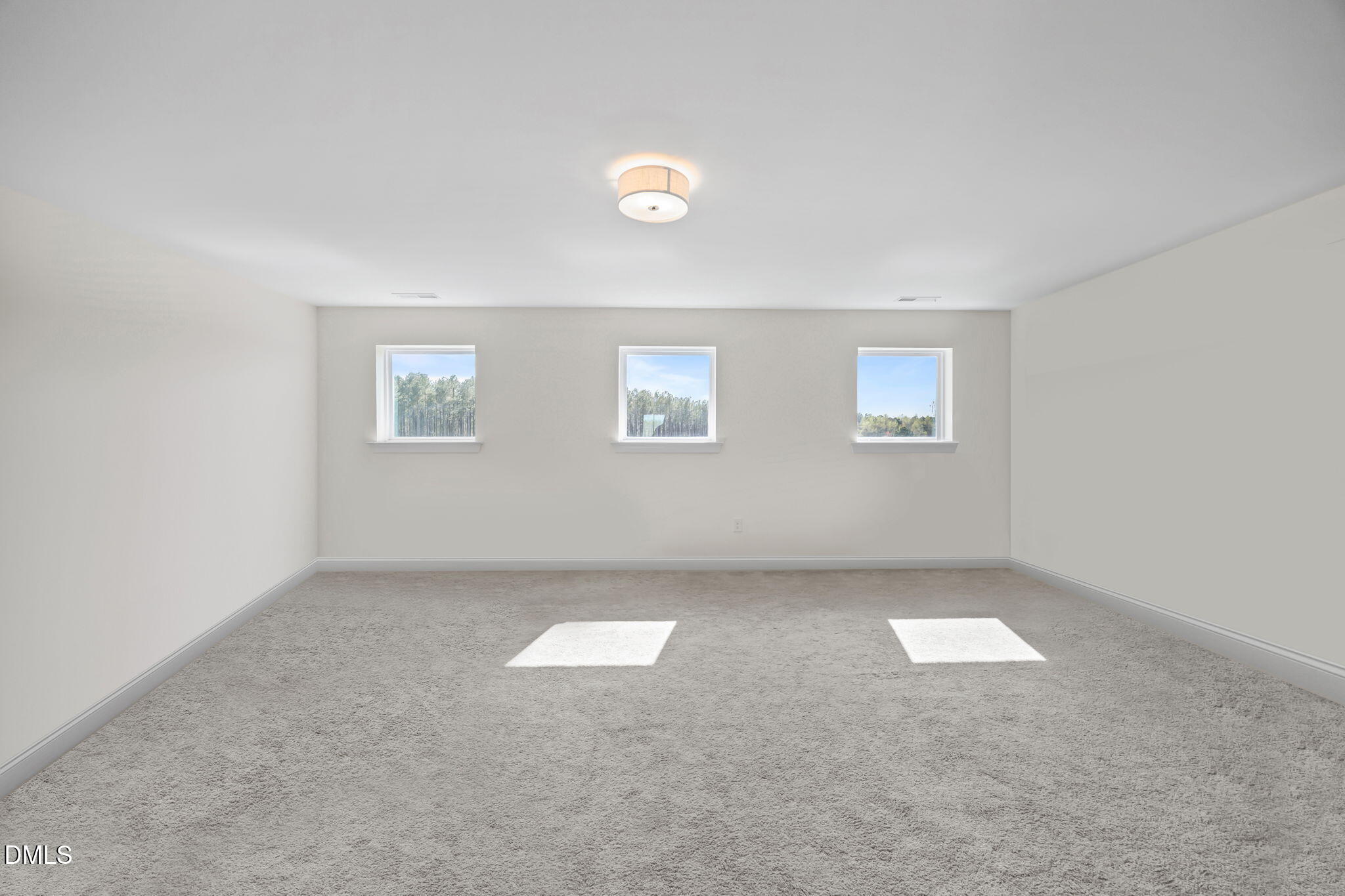 1049 Firetower Road Louisburg, NC 27549 - Photo 31 of 52 an empty room with windows