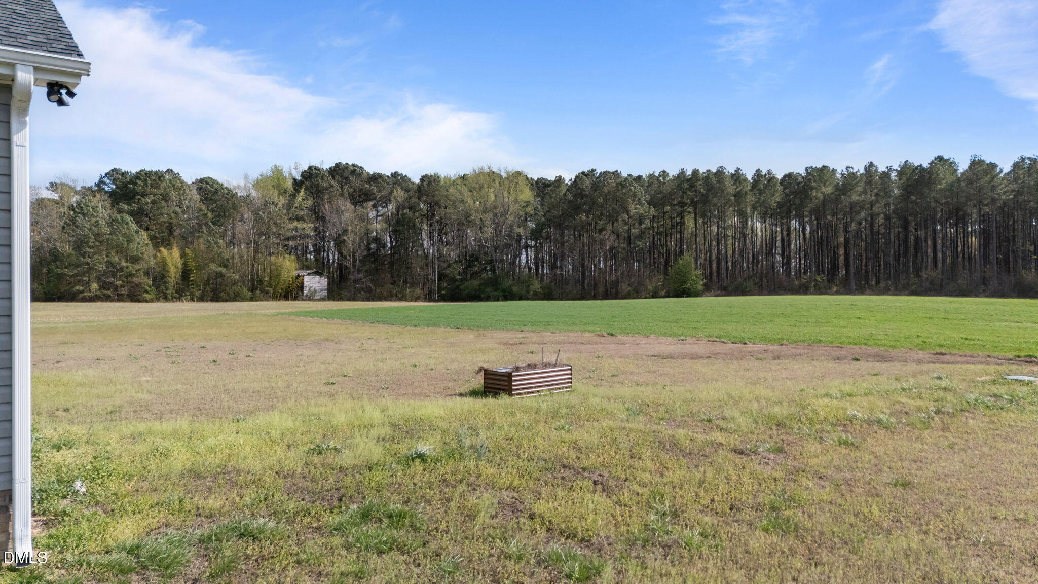 1049 Firetower Road Louisburg, NC 27549 - Photo 42 of 52 a backyard of a house with lots of green space