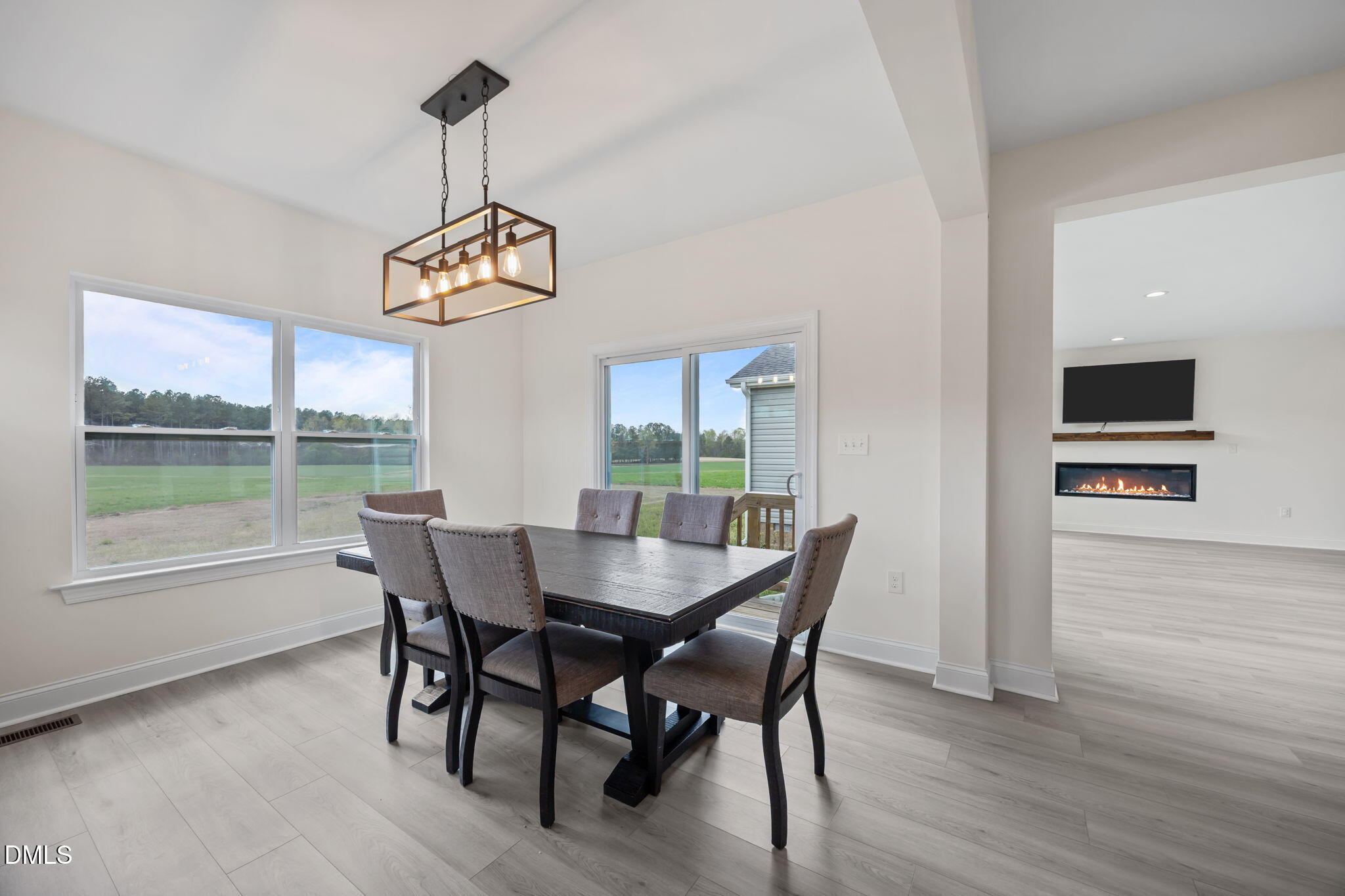 1049 Firetower Road Louisburg, NC 27549 - Photo 7 of 52 a view of a dining room with furniture window and wooden floor