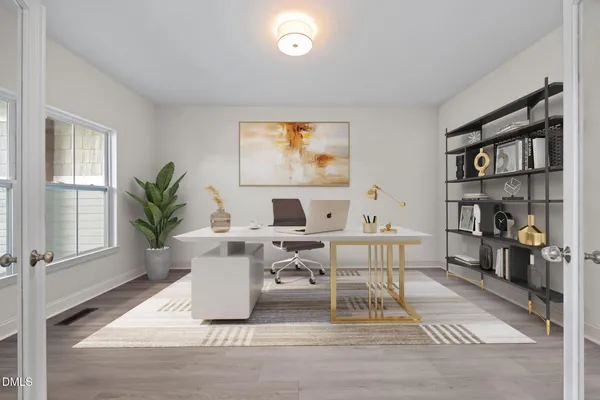 a living room with furniture a bookshelf and a window