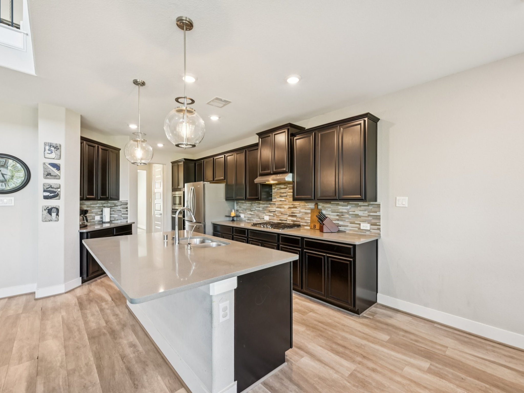 2505 Hatton Terrace Lane Pearland, TX 77089 - Photo 15 of 44 a kitchen with stainless steel appliances granite countertop a sink a stove and a refrigerator