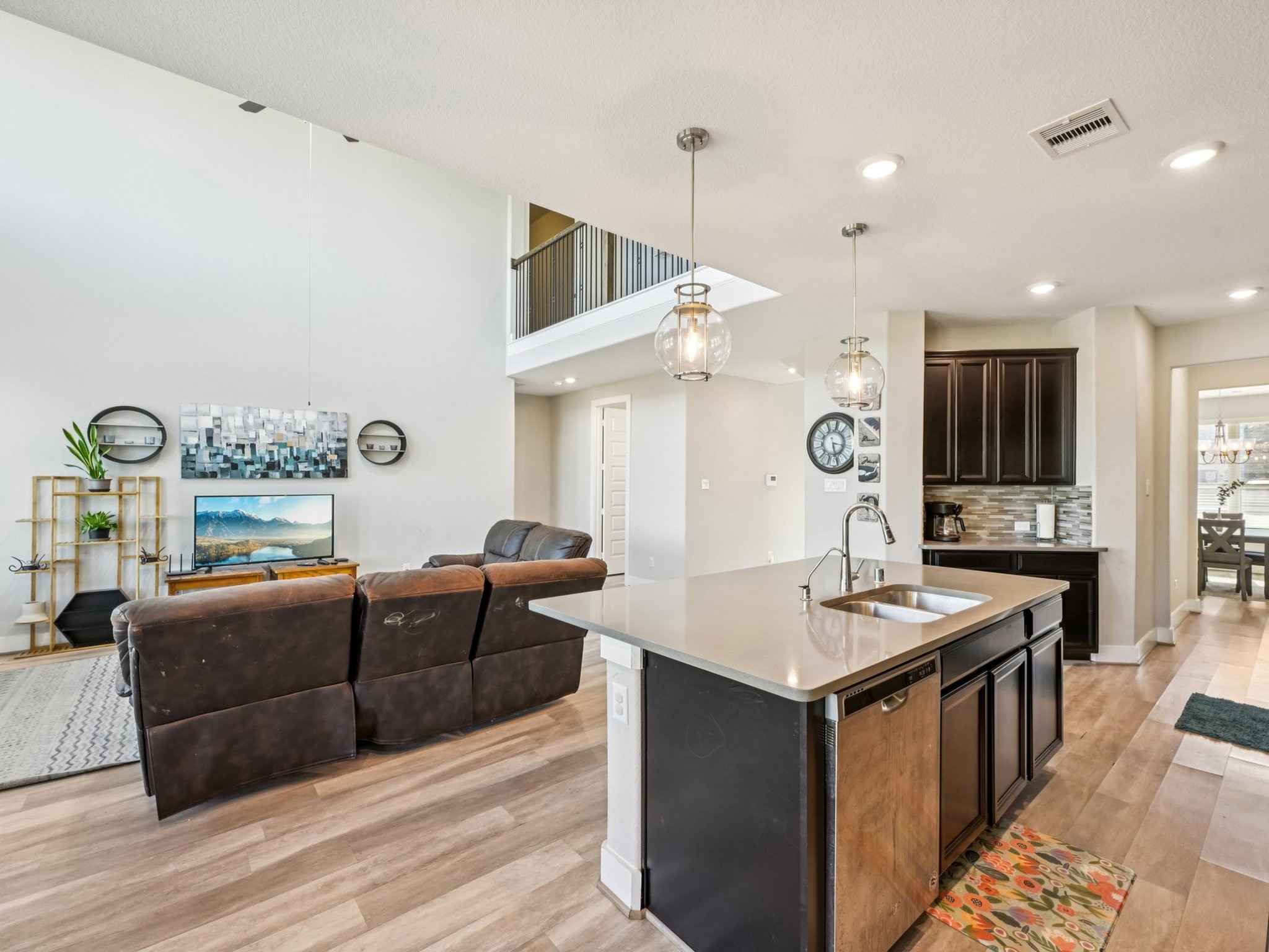 2505 Hatton Terrace Lane Pearland, TX 77089 - Photo 18 of 44 a living room with furniture kitchen area and a wooden floor