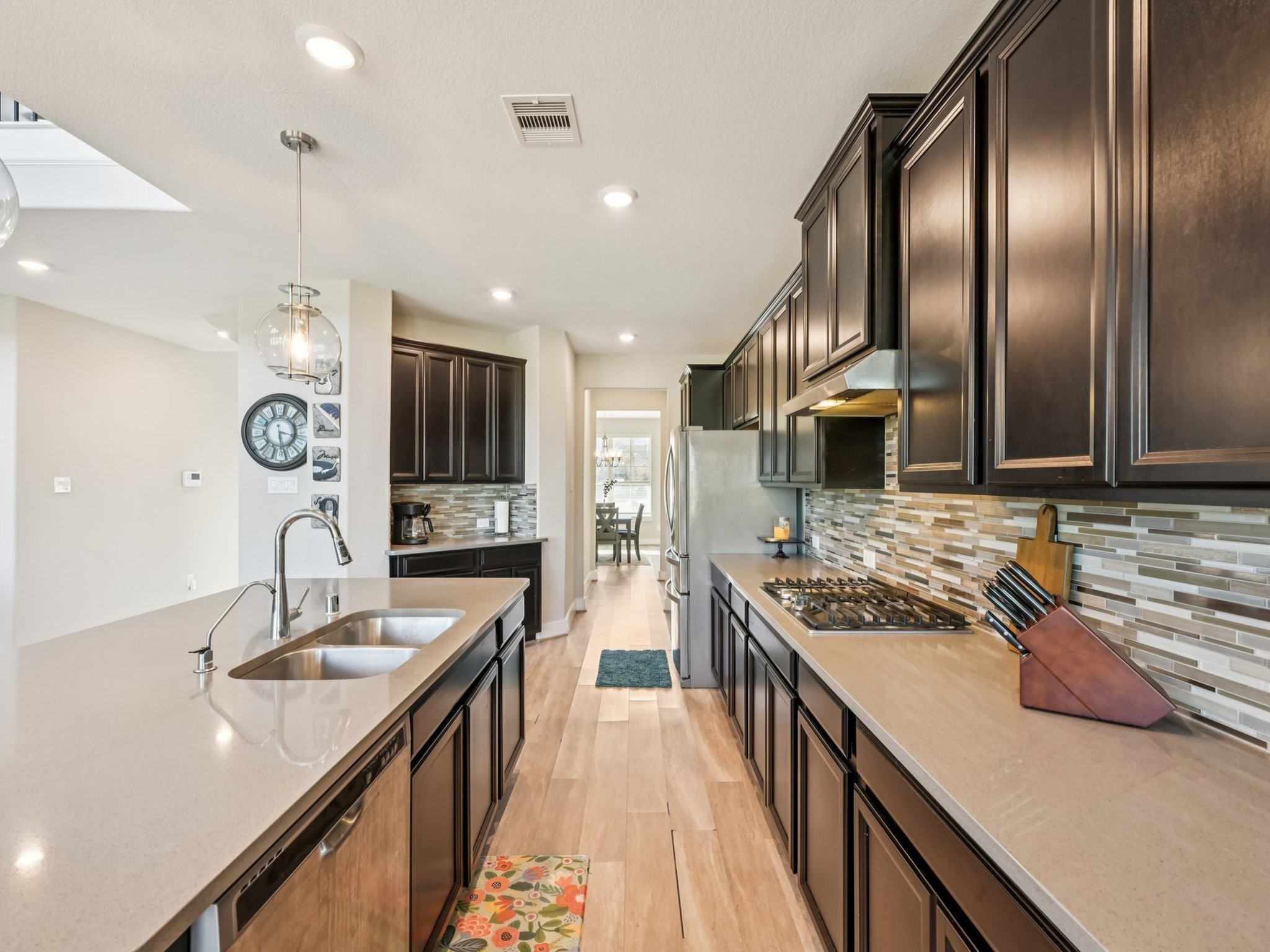 2505 Hatton Terrace Lane Pearland, TX 77089 - Photo 19 of 44 a kitchen with stainless steel appliances granite countertop a sink stove and refrigerator