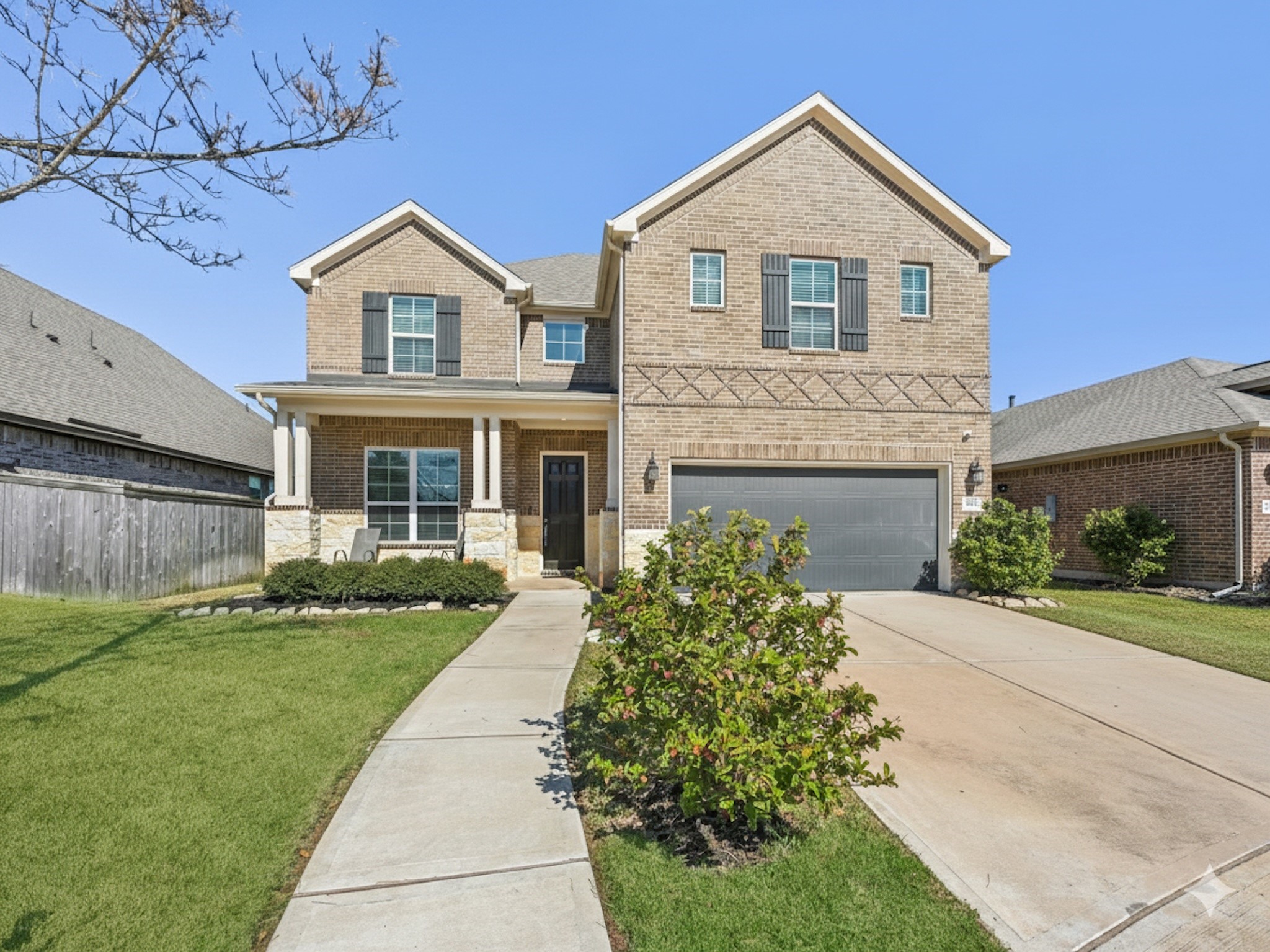2505 Hatton Terrace Lane Pearland, TX 77089 - Photo 2 of 44 a front view of a house with a yard and garage