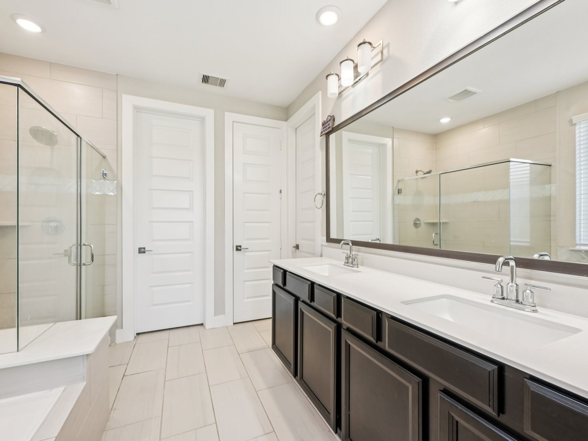 2505 Hatton Terrace Lane Pearland, TX 77089 - Photo 25 of 44 a spacious bathroom with a shower sink double and mirror