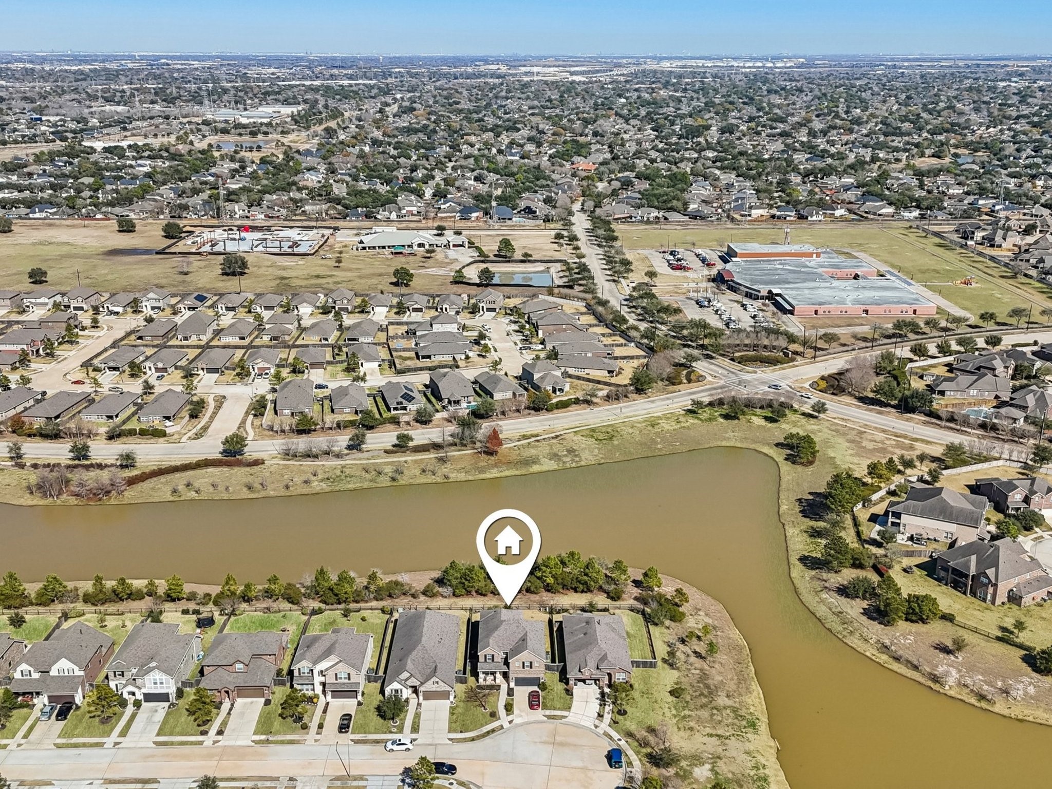 2505 Hatton Terrace Lane Pearland, TX 77089 - Photo 41 of 44 an aerial view of a house with a lake