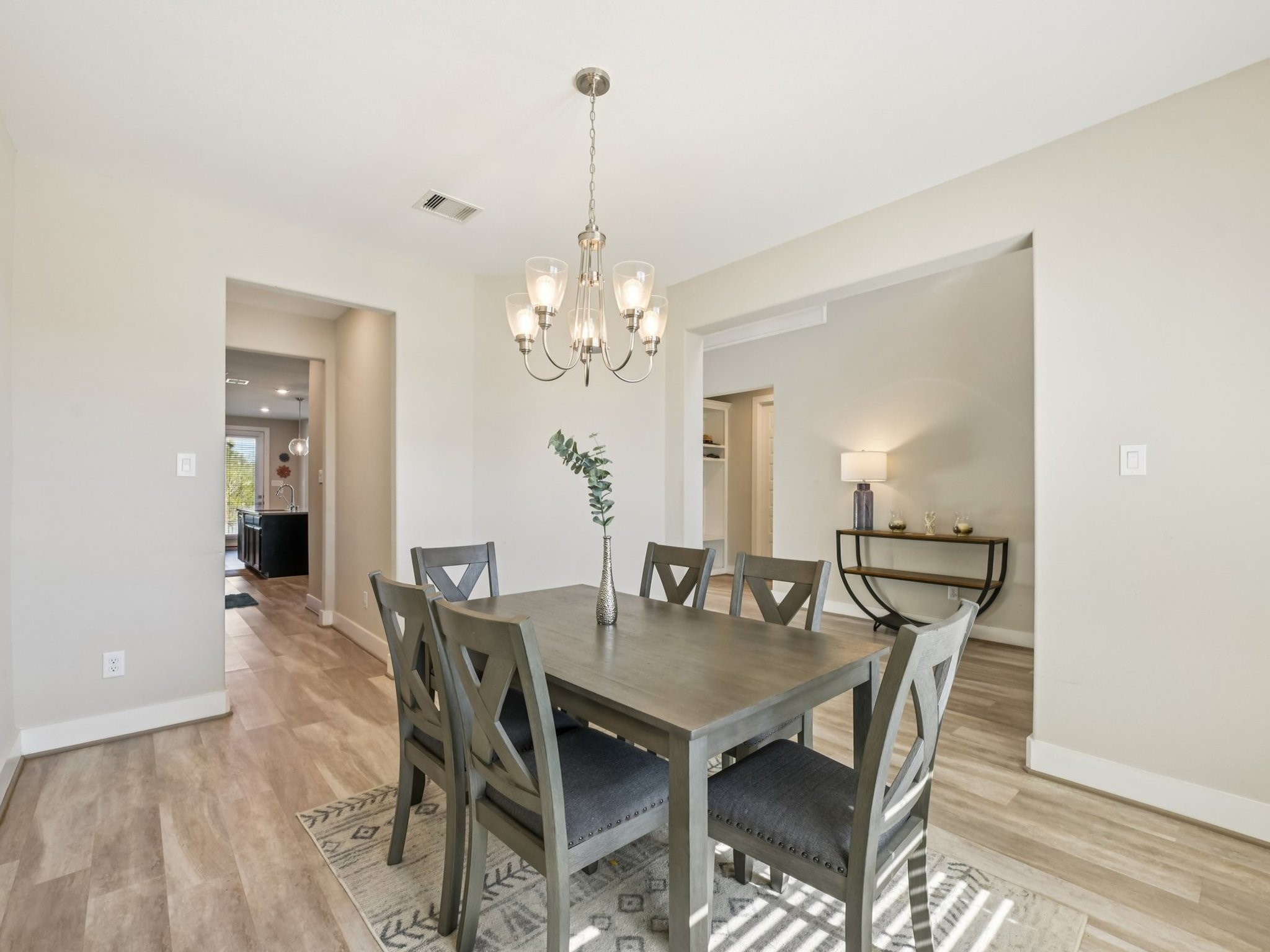 2505 Hatton Terrace Lane Pearland, TX 77089 - Photo 8 of 44 a view of a dining room with furniture and wooden floor
