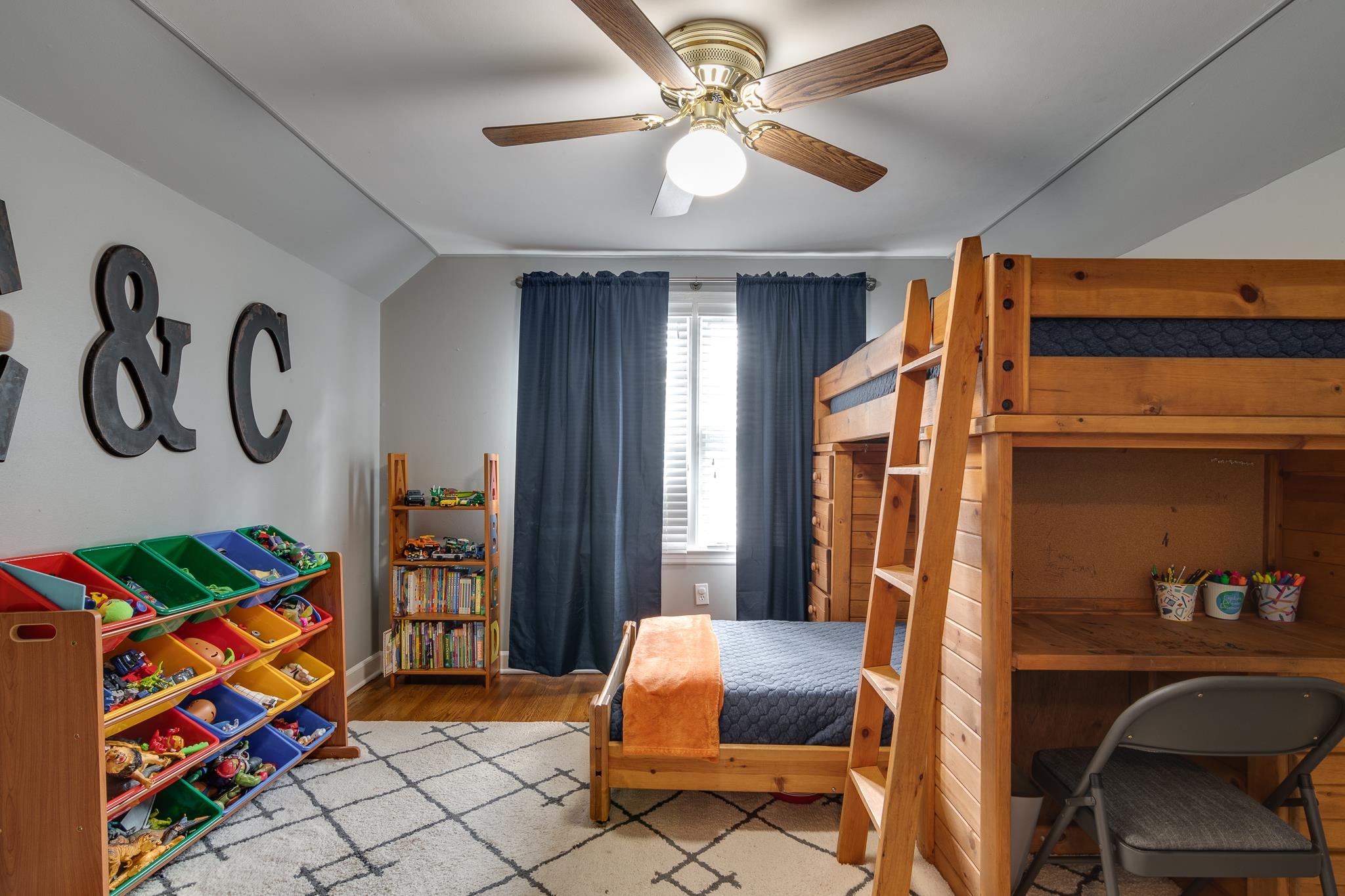 4892 Kaye Road Memphis, TN 38117 - Photo 13 of 17 a bedroom with a bed and a chandelier
