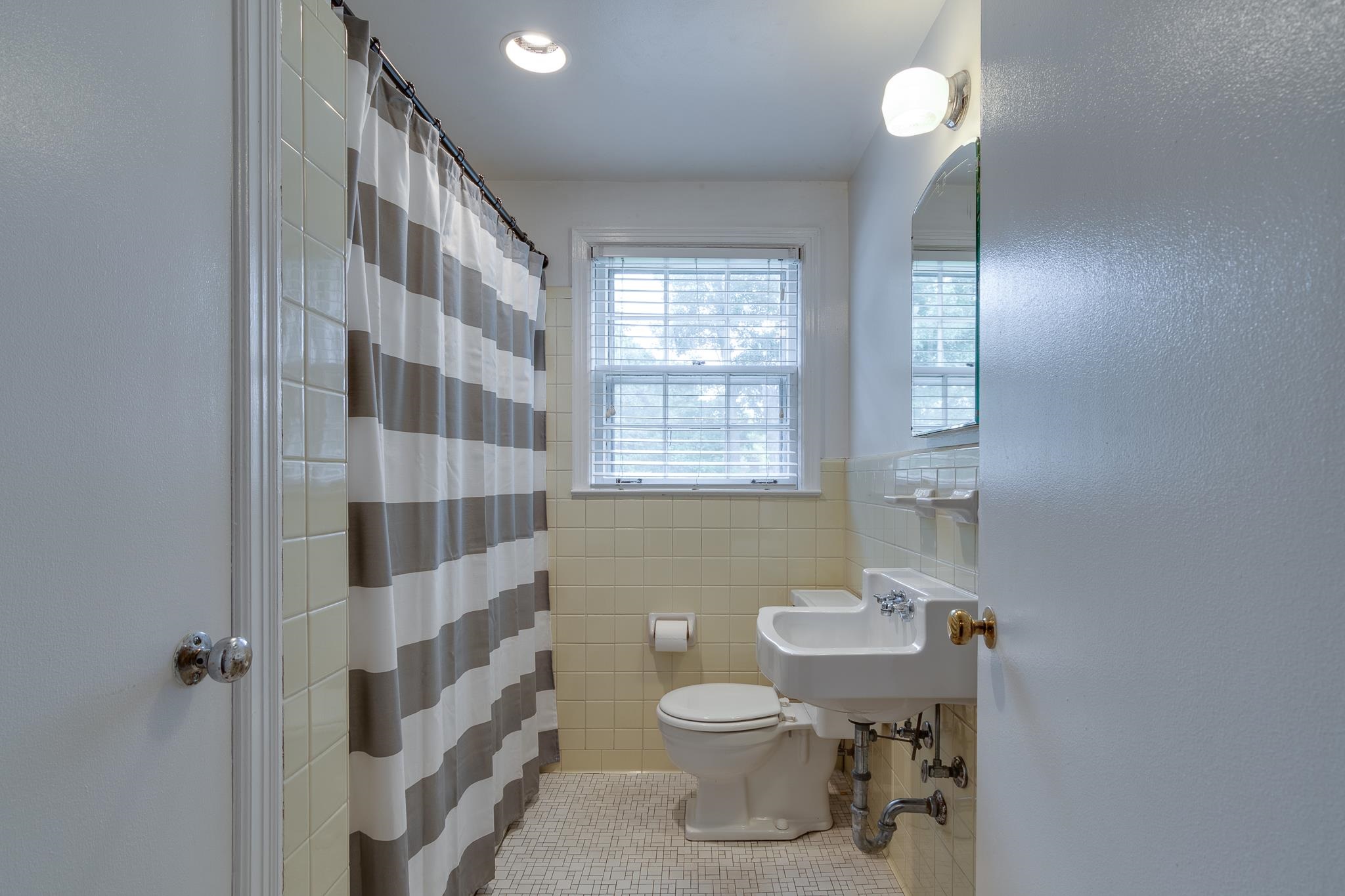 4892 Kaye Road Memphis, TN 38117 - Photo 14 of 17 a bathroom with a sink toilet and shower