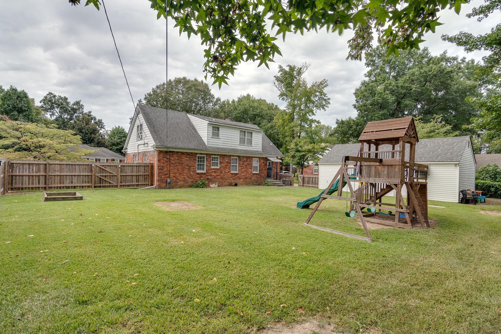 4892 Kaye Road Memphis, TN 38117 - Photo 17 of 17 a view of a garden with a slide