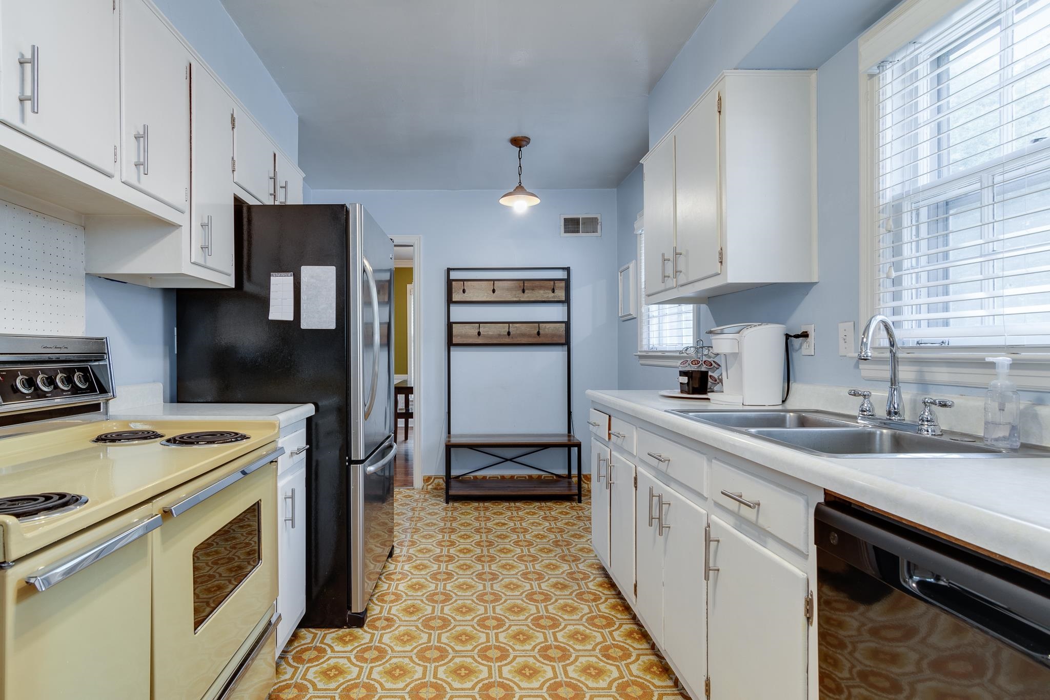 4892 Kaye Road Memphis, TN 38117 - Photo 7 of 17 a kitchen with a sink stove and refrigerator