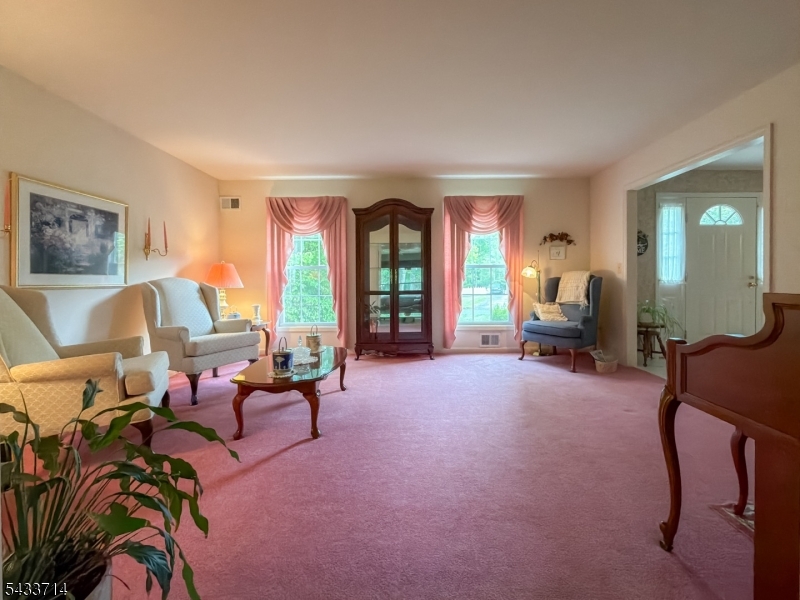 29 Lark Lane Oak Ridge, NJ 07438 - Photo 11 of 26 a living room with furniture and a large window