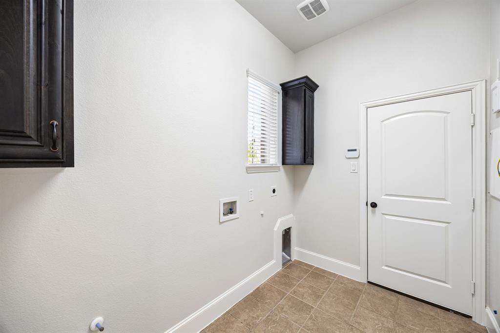 1567 Red Rock Canyon Road Frisco, TX 75036 - Photo 27 of 36 Laundry room with built in cabinets.