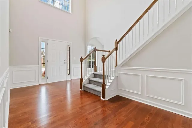 a view of an entryway with wooden floor