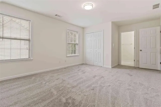 a bathroom with a toilet and shower