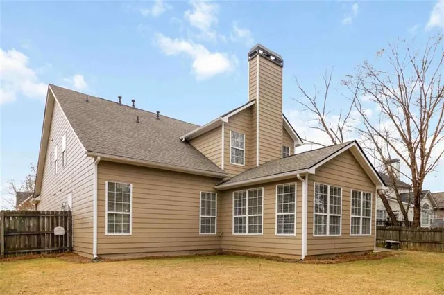 a house with trees in the background