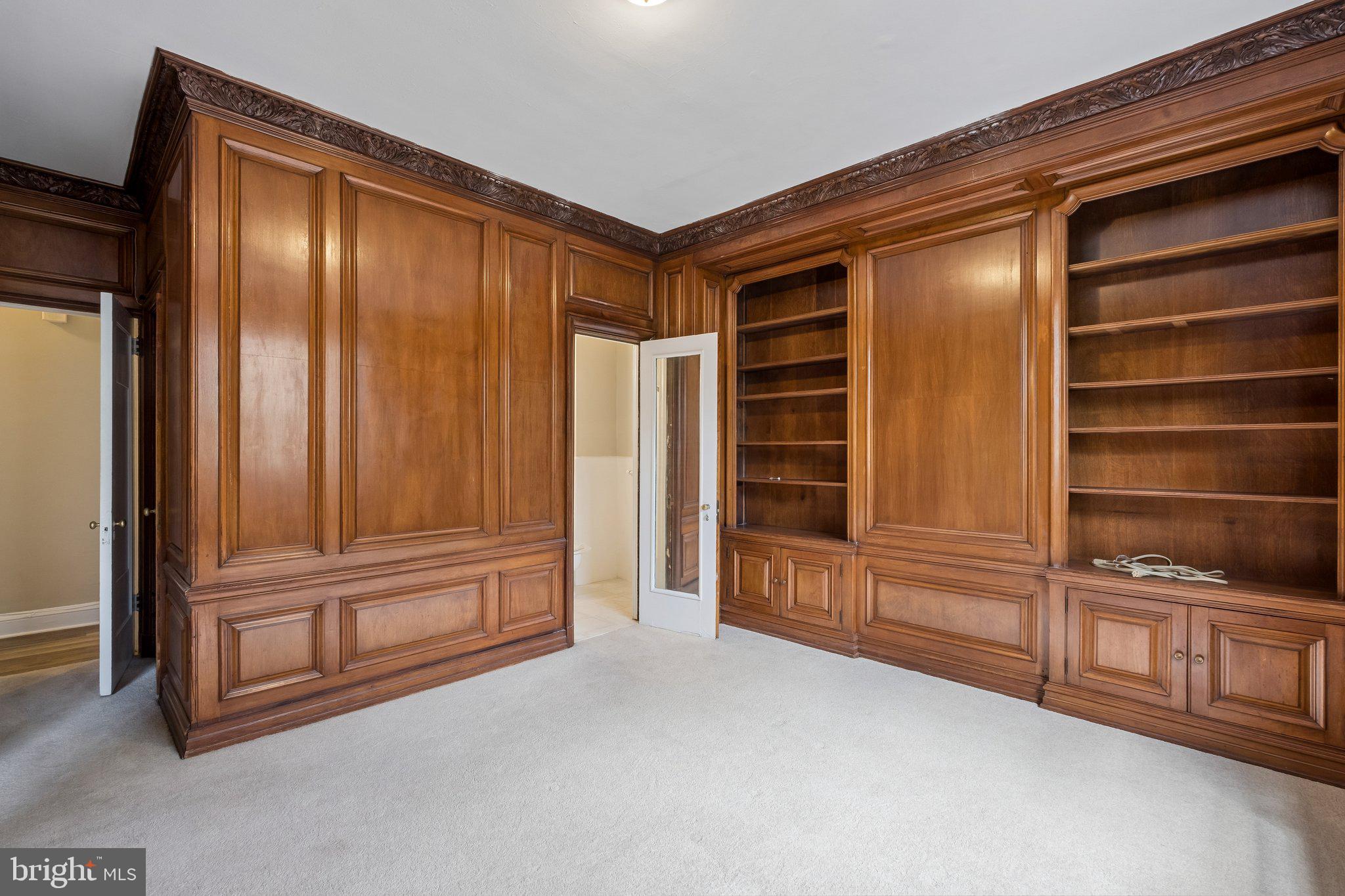 2031 Locust Street, Unit 101 Philadelphia, PA 19103 - Photo 11 of 23 a view of an empty room with wooden walls