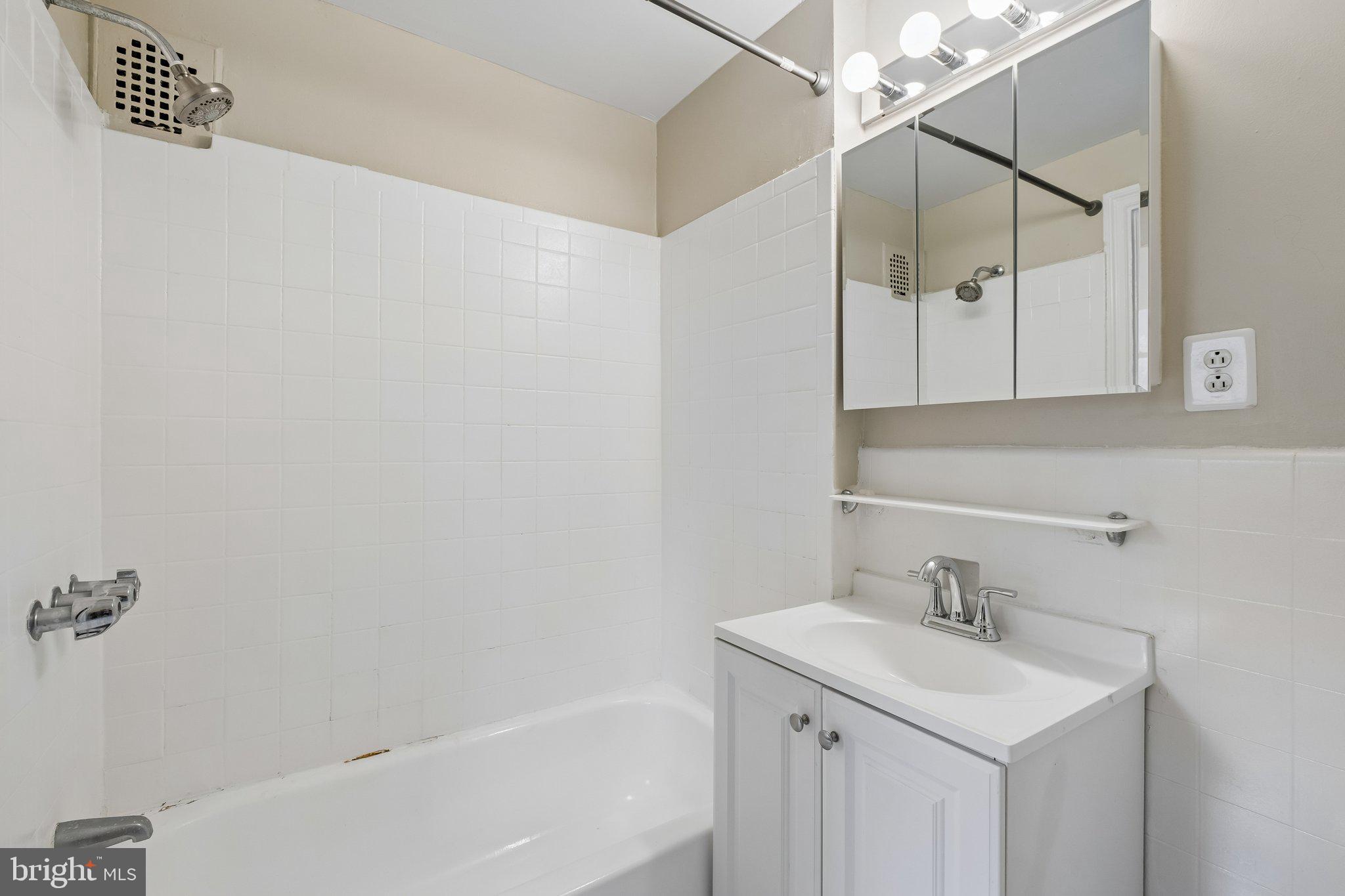 2031 Locust Street, Unit 101 Philadelphia, PA 19103 - Photo 12 of 23 a bathroom with a sink and a bathtub