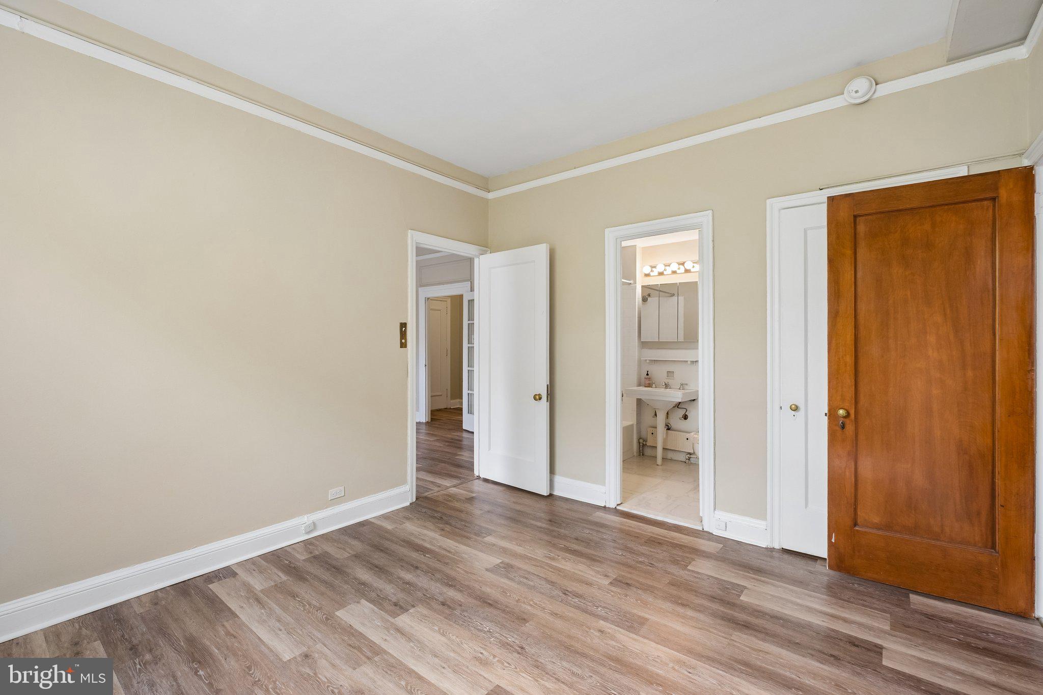 2031 Locust Street, Unit 101 Philadelphia, PA 19103 - Photo 8 of 23 wooden floor in an empty room