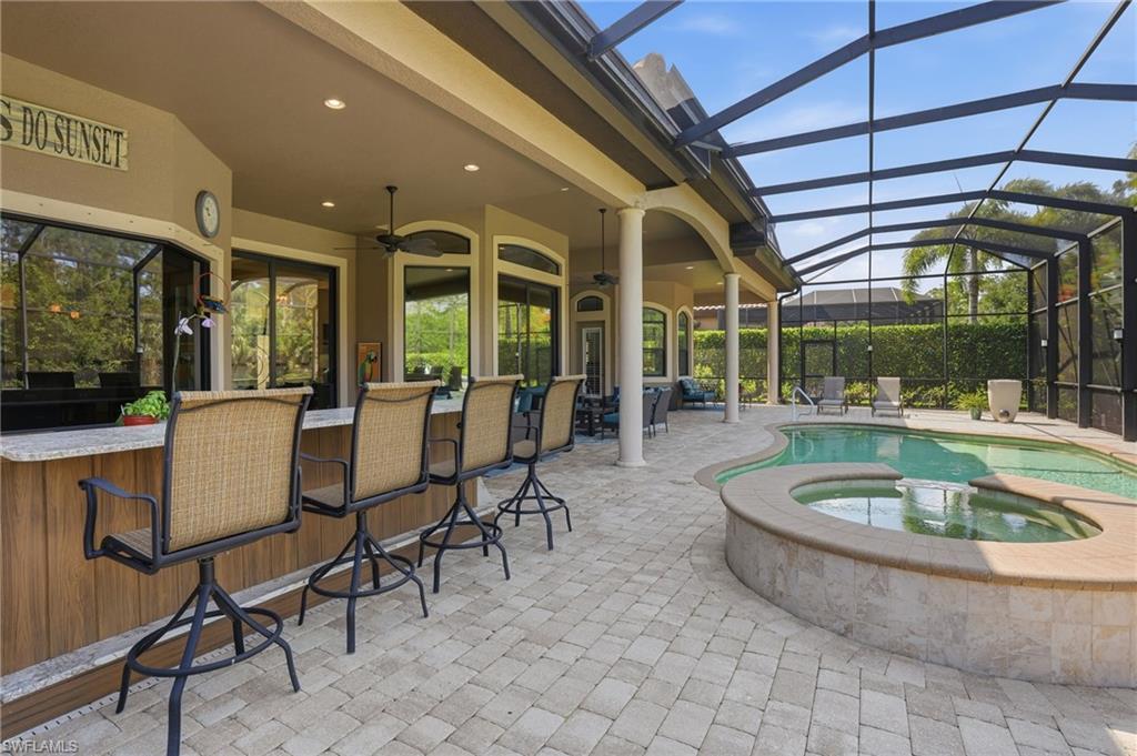 6453 Costa Circle Naples, FL 34113 - Photo 32 of 47 Relax in the pool or entertain in this fully equipped outdoor kitchen