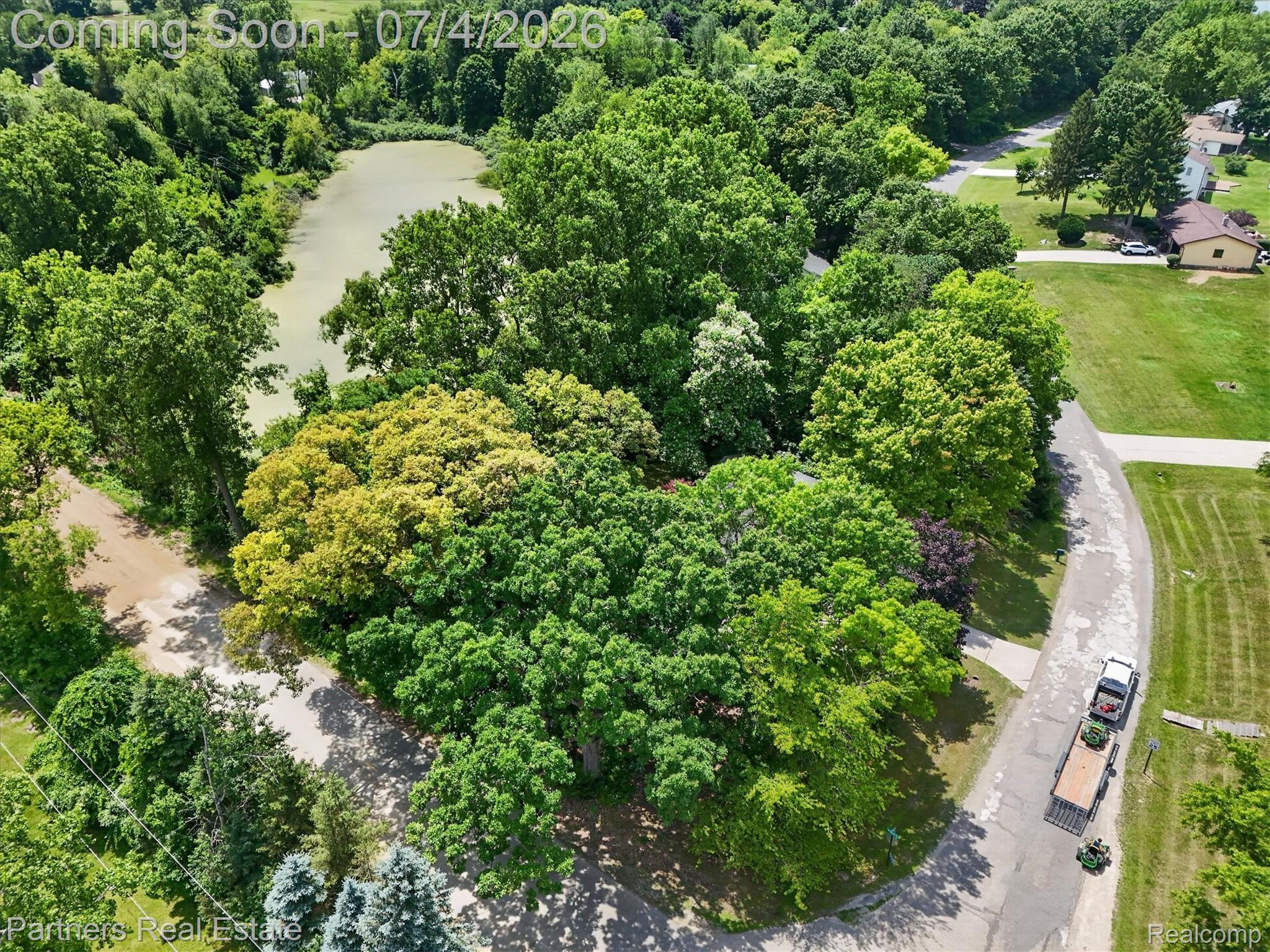 2500 Hubert Road Brighton, MI 48114 - Photo 52 of 53 Wooded lot with abundant mature trees and frontage on a natural pond