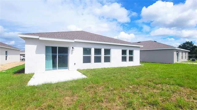 a view of a yard in front of a house