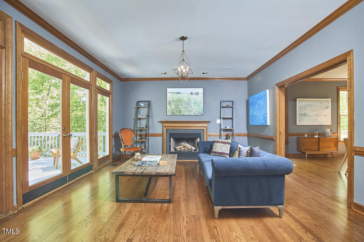 8407 Millers Bend Bahama, NC 27503 - Photo 24 of 77 a living room with fireplace furniture and a large window