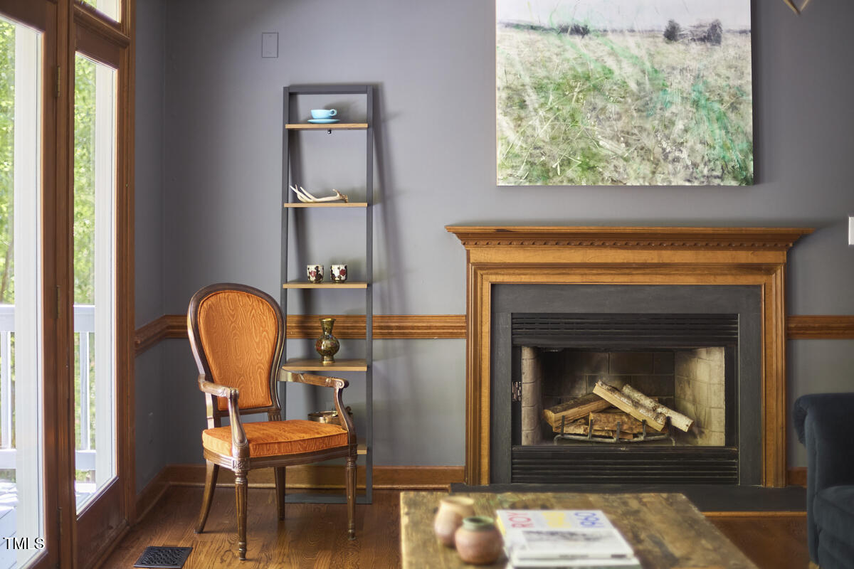 8407 Millers Bend Bahama, NC 27503 - Photo 25 of 77 a living room with furniture and a fireplace