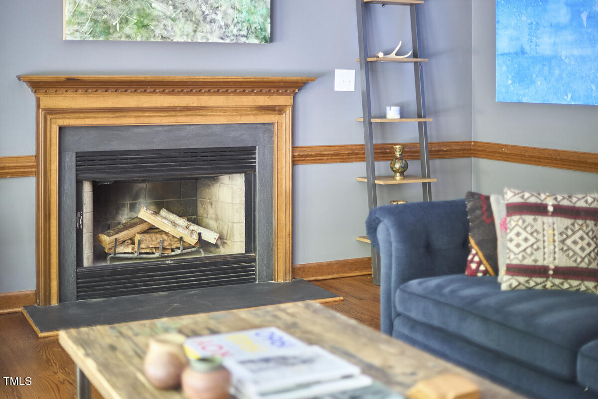 8407 Millers Bend Bahama, NC 27503 - Photo 26 of 77 a living room with furniture and a fireplace