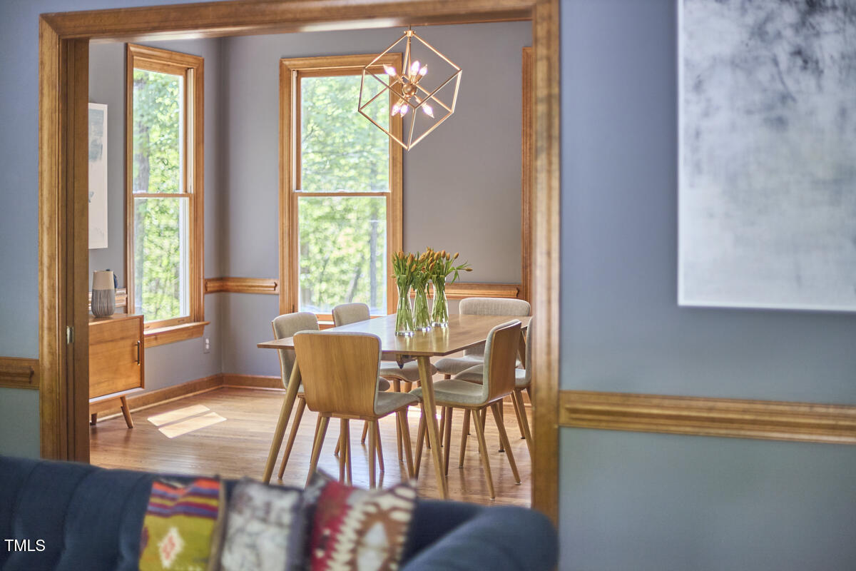 8407 Millers Bend Bahama, NC 27503 - Photo 27 of 77 a dining room with furniture and wooden floor