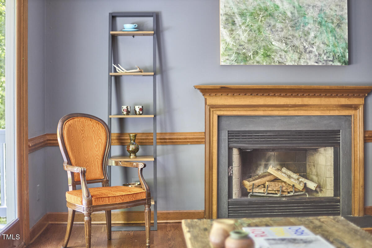 8407 Millers Bend Bahama, NC 27503 - Photo 28 of 77 a living room with chairs and a fireplace