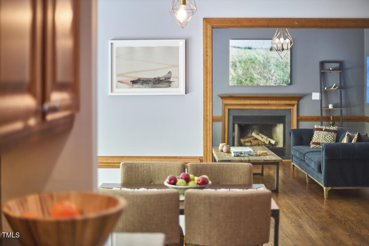 8407 Millers Bend Bahama, NC 27503 - Photo 33 of 77 a living room with furniture and a fireplace