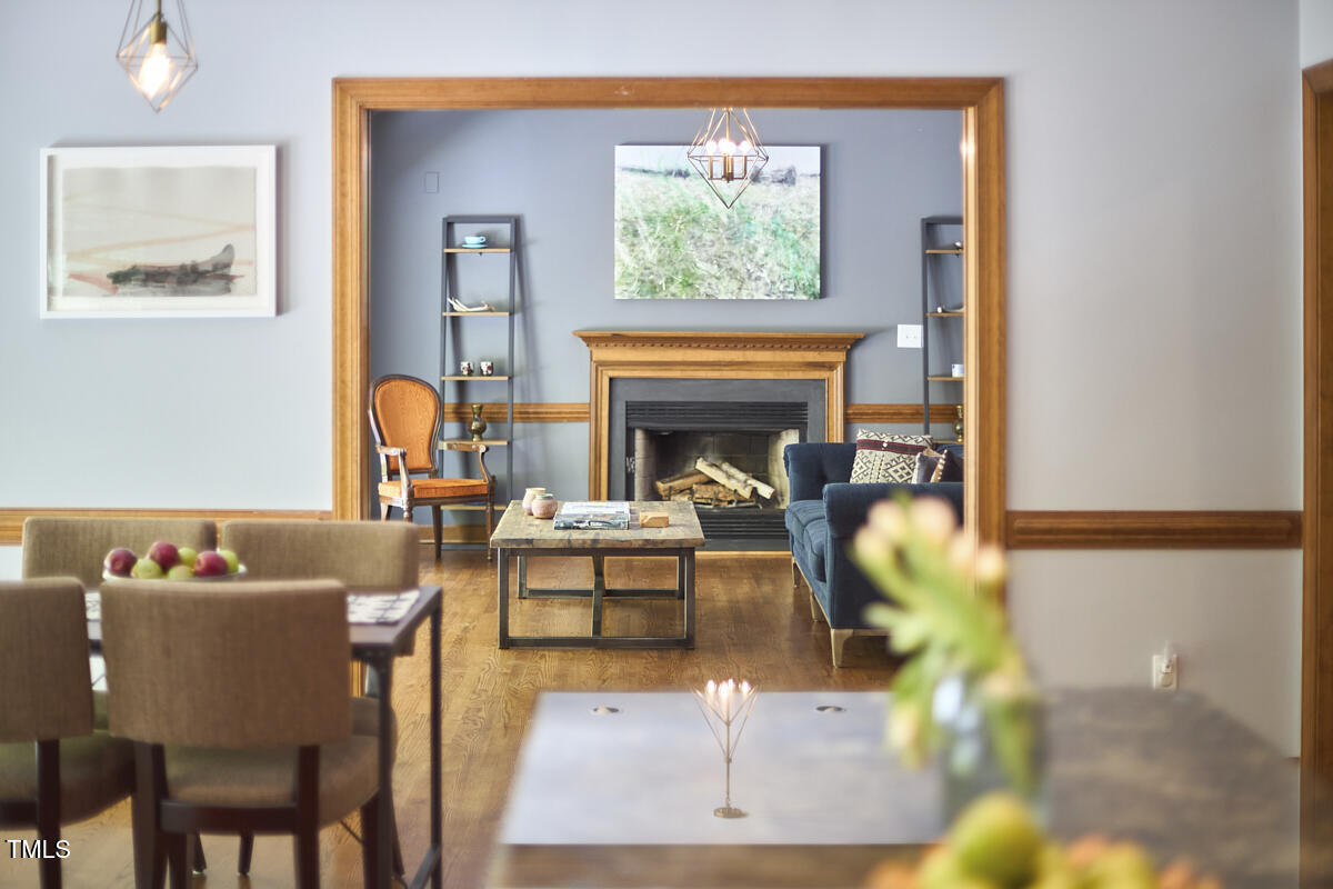8407 Millers Bend Bahama, NC 27503 - Photo 39 of 77 a living room with furniture and a fireplace