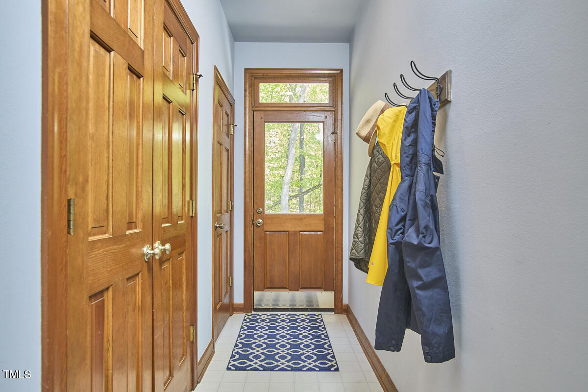 8407 Millers Bend Bahama, NC 27503 - Photo 42 of 77 a view of walk in closet with clothes and shoes
