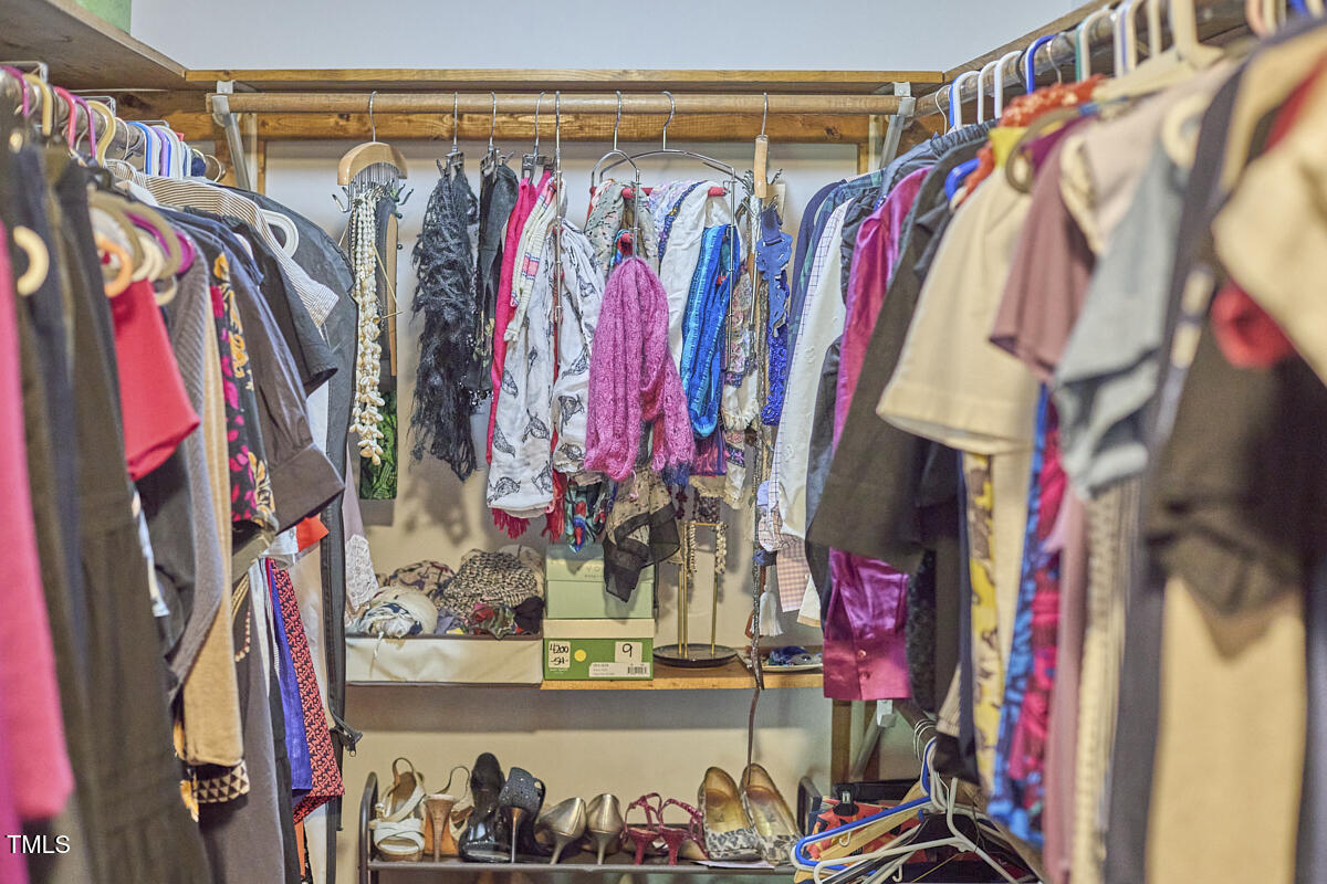 8407 Millers Bend Bahama, NC 27503 - Photo 49 of 77 a view of walk in closet with clothes