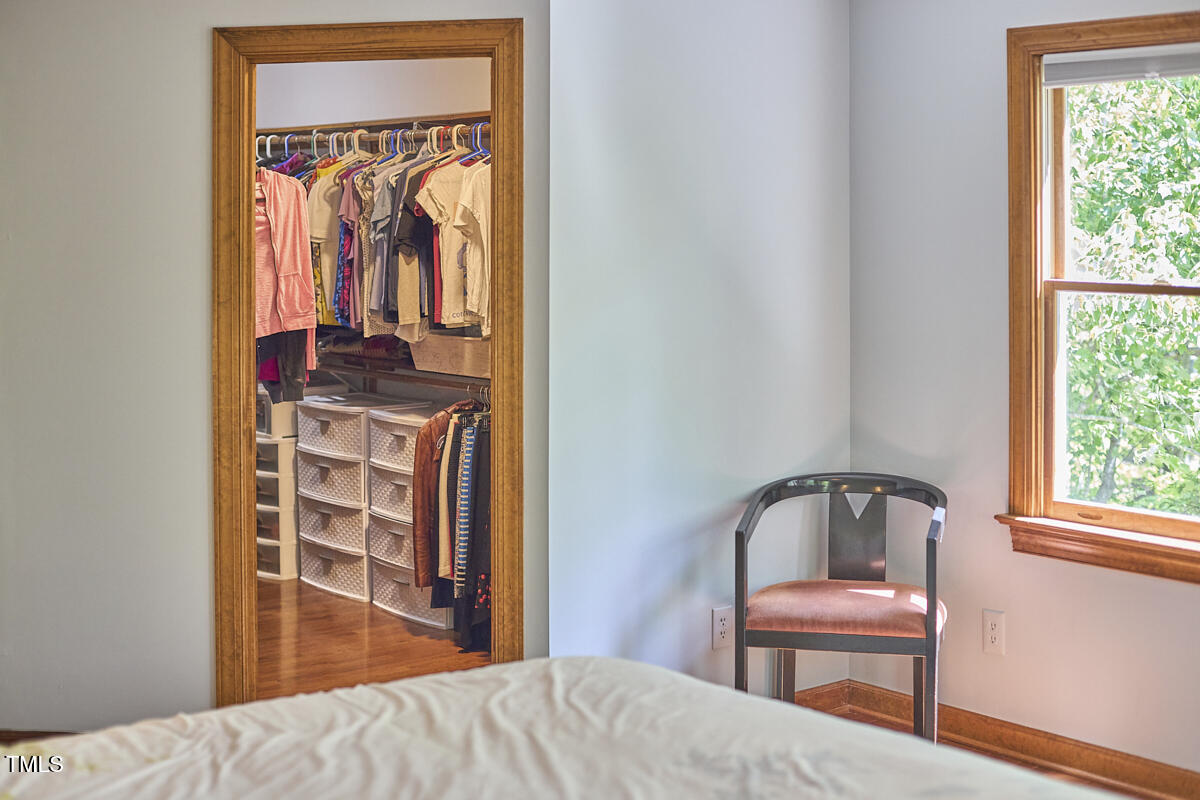 8407 Millers Bend Bahama, NC 27503 - Photo 50 of 77 a bedroom with a bed and a closet