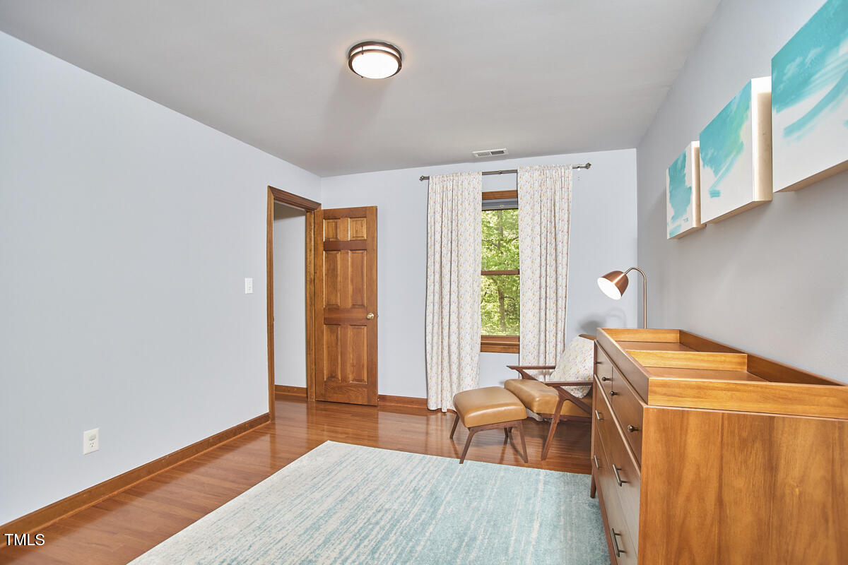 8407 Millers Bend Bahama, NC 27503 - Photo 51 of 77 a dining room with a window and wooden floor