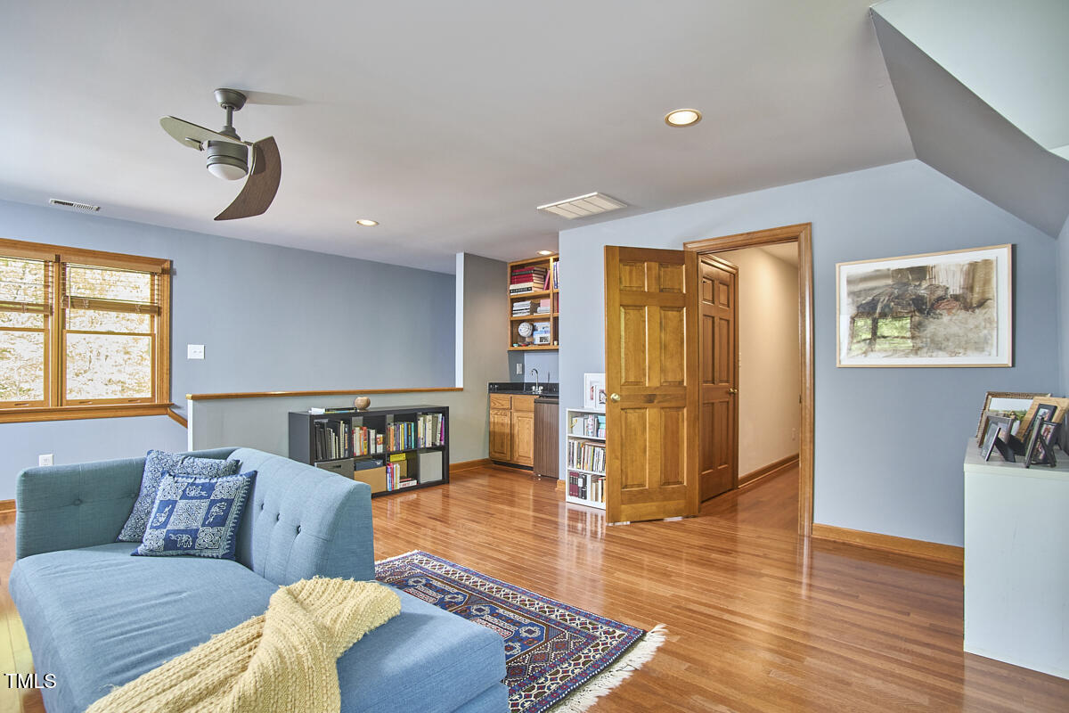 8407 Millers Bend Bahama, NC 27503 - Photo 56 of 77 a living room with furniture and wooden floor
