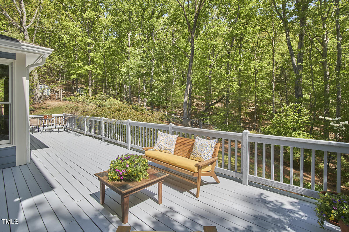 8407 Millers Bend Bahama, NC 27503 - Photo 69 of 77 a roof deck with a table and chairs