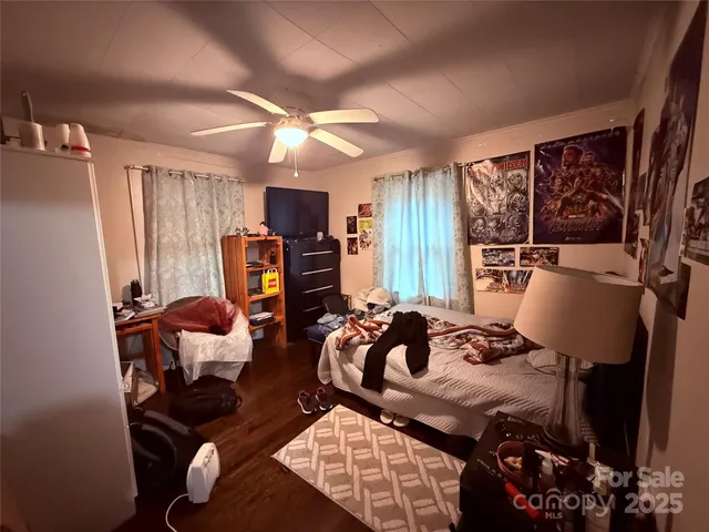 a bedroom with furniture and a window