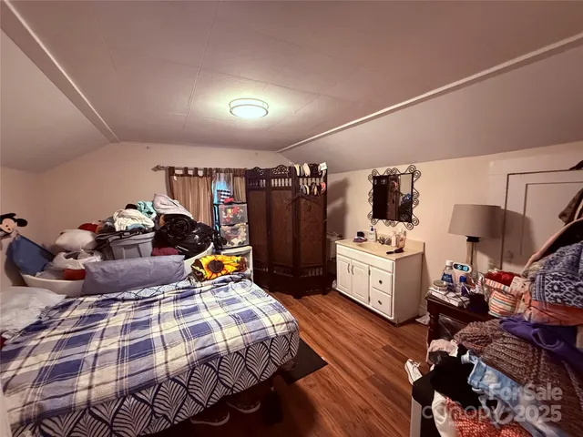 a bed room with furniture and a gym