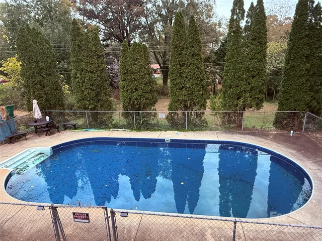 a view of outdoor space and swimming pool