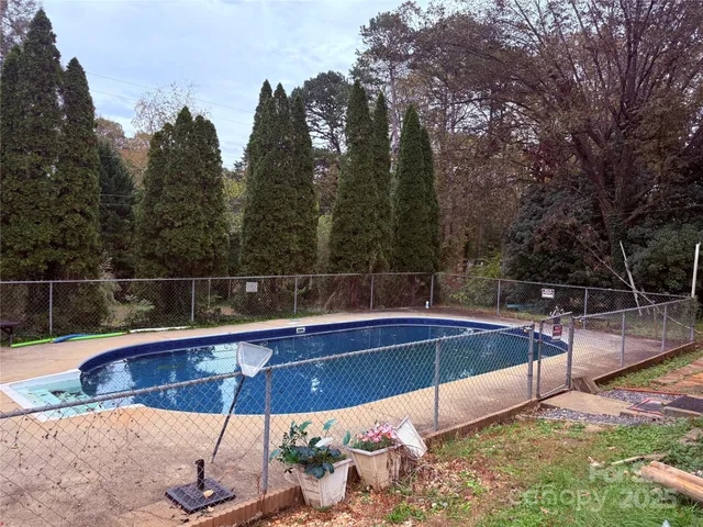 a view of a swimming pool with a patio