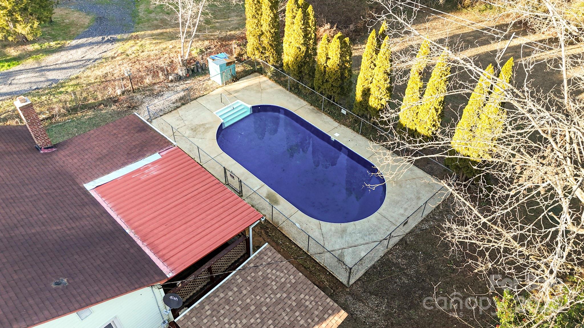 375 20th Avenue Northeast Hickory, NC 28601 - Photo 3 of 38 a wooden bench sitting in front of a building