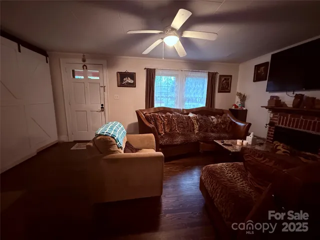 a living room with furniture and a flat screen tv