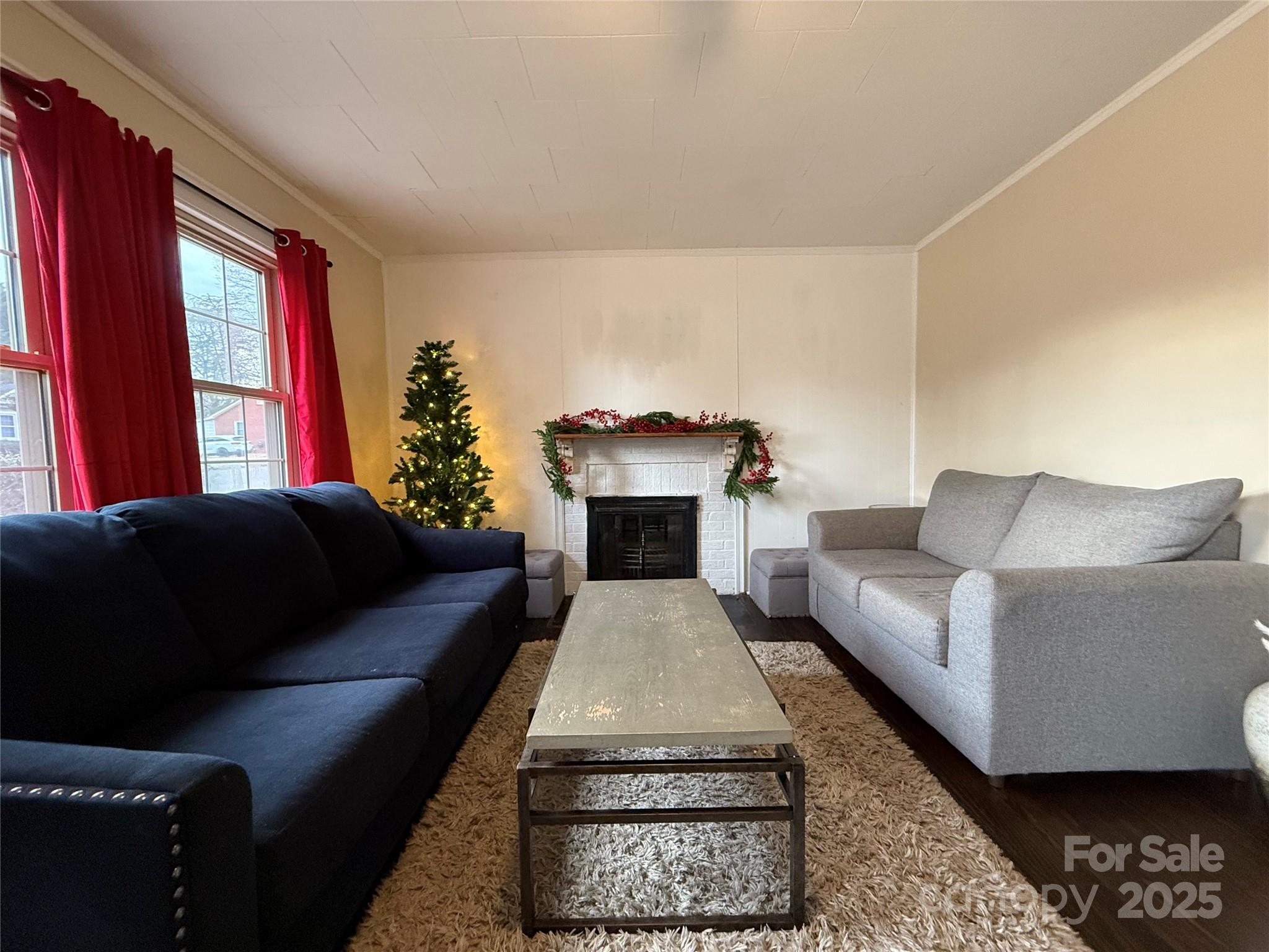 375 20th Avenue Northeast Hickory, NC 28601 - Photo 9 of 38 a living room with furniture and a fireplace