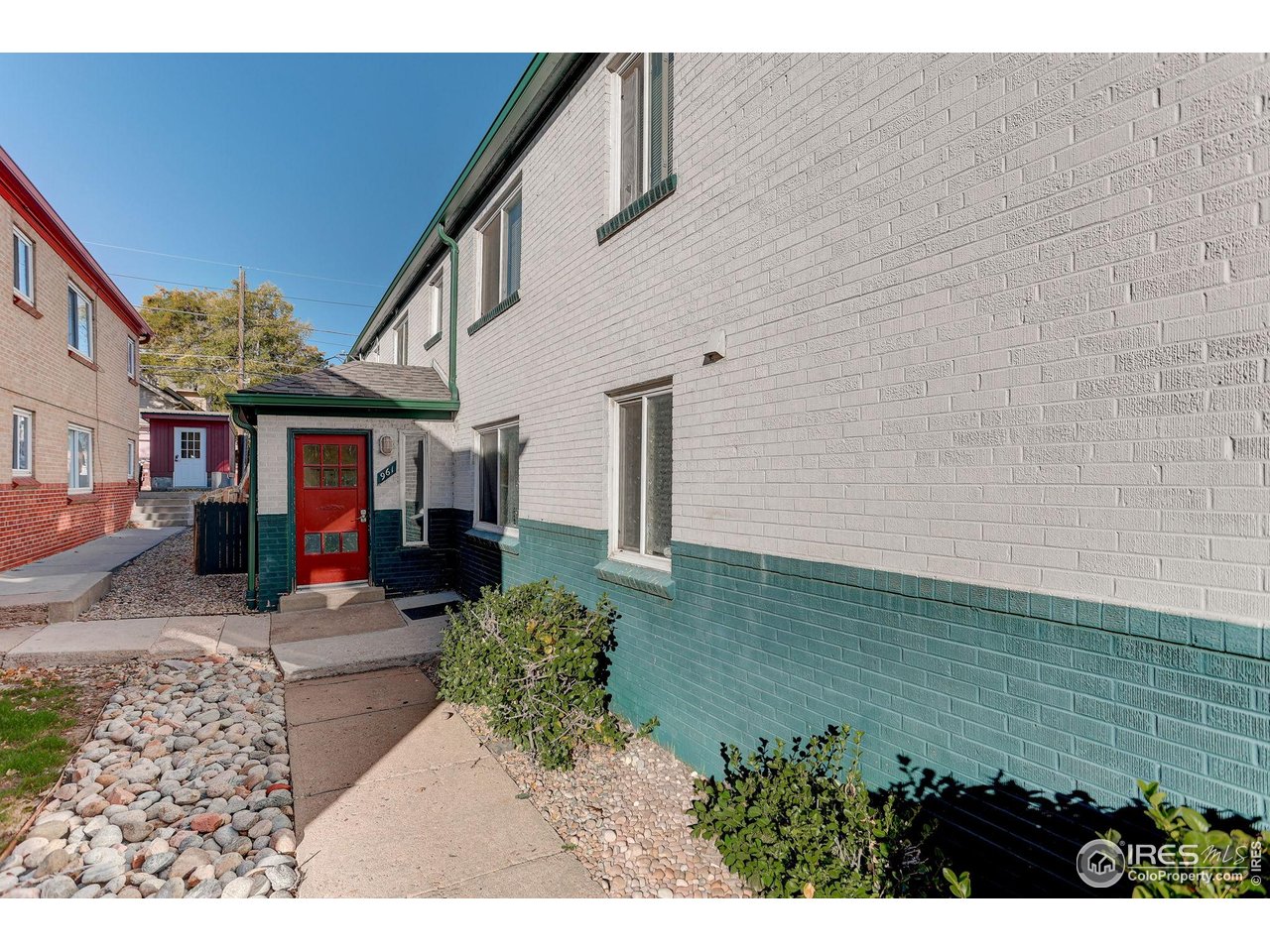 961 16th Street, Unit 5 Boulder, CO 80302 - Photo 15 of 19 a front view of a house with a yard