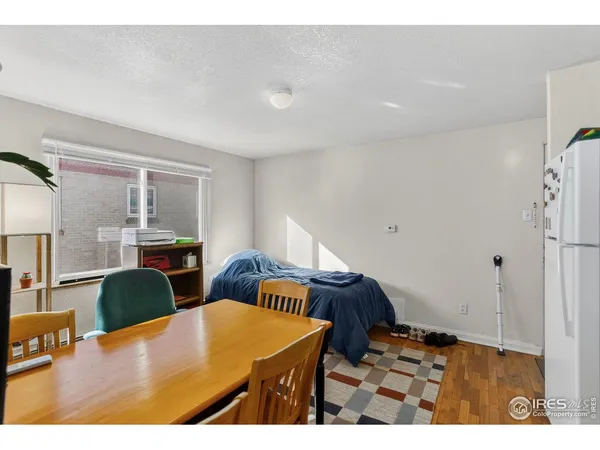 a living room with furniture and a lamp