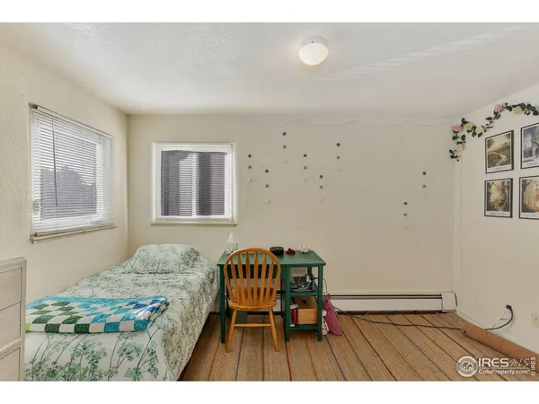 a bedroom with a bed and a table in it